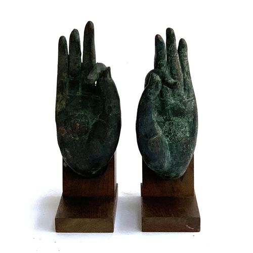 152 - A pair of bronze hands in mudra pose, 23cmH