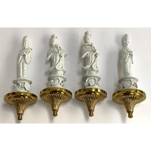 83 - A set of four blanc de chine figural wall sconces of Boddhisatvas mounted on gilt metal plinths, one... 