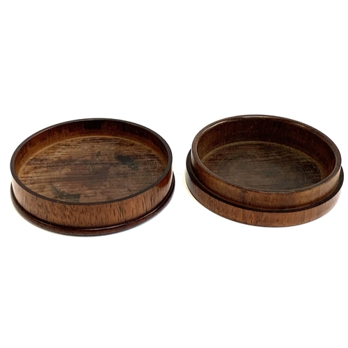 114 - A fruitwood turned treen cylindrical box, the lid inset with white metal plaque, 10.3cmD, 3.2cmH