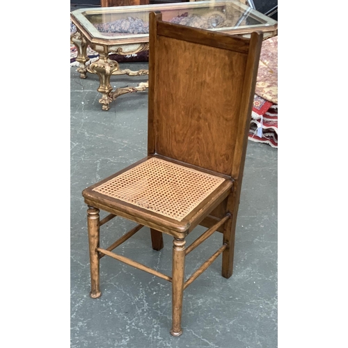 671 - A caned occasional chair, the back incorporating a trouser press