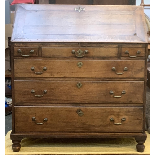 677 - An 18th century oak bureau, fall front over three shallow drawers and three graduating drawers, on l... 