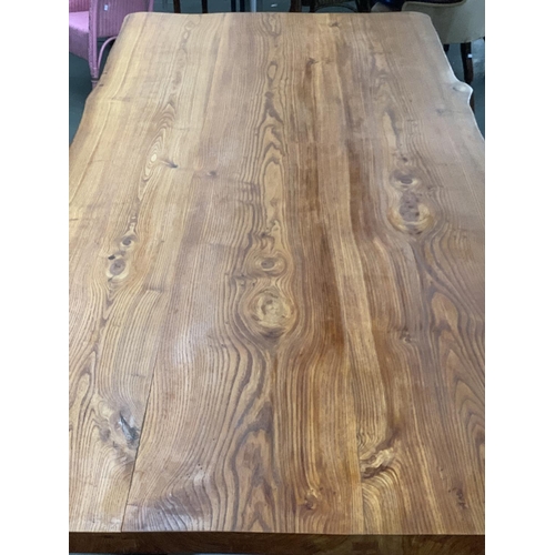 705 - A very large bespoke made elm kitchen table, three plank top approx. 2 inches thick, on a refectory ... 