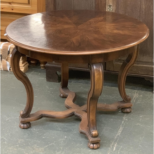 745 - A burr walnut centre table, with shaped cross stretcher, 91x65.5cmH