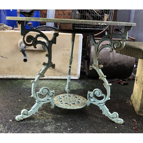 569 - A French cast iron garden table with marble top, 92cmD, 70cmH