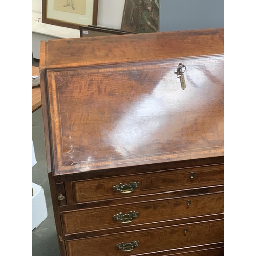 776 - A 19th century mahogany and satinwood banded bureau, fall front over four graduating drawers on brac... 