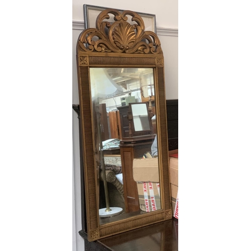 823 - A modern giltwood wall mirror with shell cresting, 53x115cmH