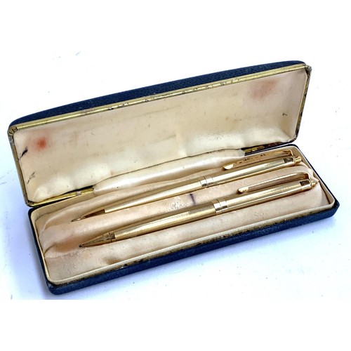 413A - A case set comprising gold plated pen and propelling pencil, together with a pair of 925 silver earr... 