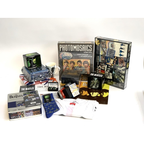 416A - A large quantity of The Beatles memorabilia to include 'It was 50 years ago today' boxset, photomosa... 