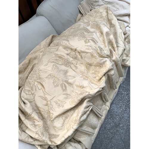 541 - A pair of heavy silk lined cream floral curtains, 215cm drop, ungathered width 366cm