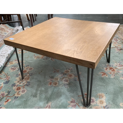 839 - A square oak coffee table on metal hairpin supports, 69x69x40cm