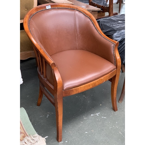 842 - A brown vinyl upholstered tub chair, 58cmW