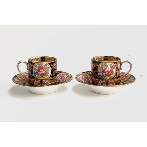 225A - A pair of 19th century Crown Staffordshire coffee cups and saucers, hand painted with floral decorat... 