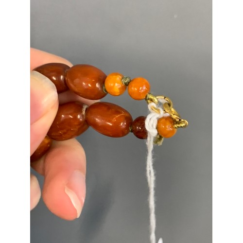 18 - A graduated cognac amber bead necklace, approx. 59g, 57cm long