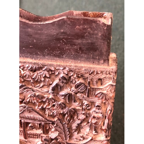 172 - A Chinese tortoiseshell card case of rectangular form, carved in relief with figures on a terrace am... 