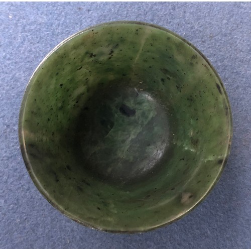 176 - A Chinese spinach jade cup, of flaring form with short form foot, approx. 6cm diameter, 4cm high