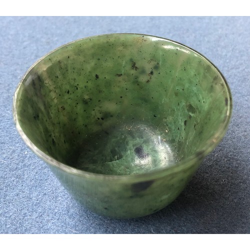 176 - A Chinese spinach jade cup, of flaring form with short form foot, approx. 6cm diameter, 4cm high