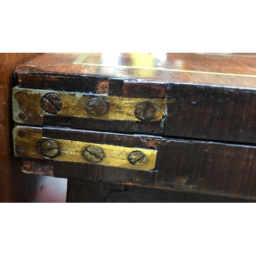 603 - A George IV rosewood and brass inlaid card table, c.1825, the folding top enclosing a baize playing ... 