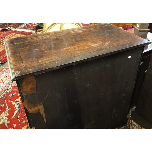 574 - A George III mahogany bachelors chest, crossbanded moulded top over a slide, with two short over thr... 