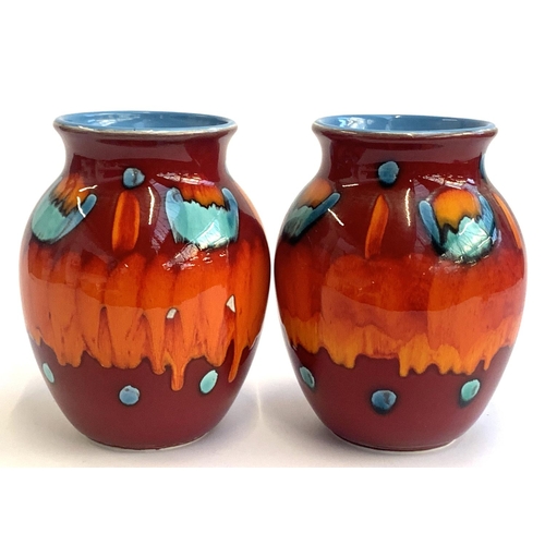 85 - A pair of Poole Pottery Volcano vases, each 25cmH