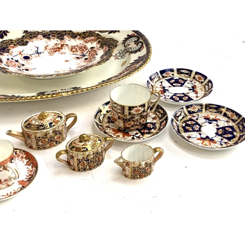 138 - A quantity of Royal Crown Derby ceramics to include coffee cup and sauce; meat plate; teacup and thr... 