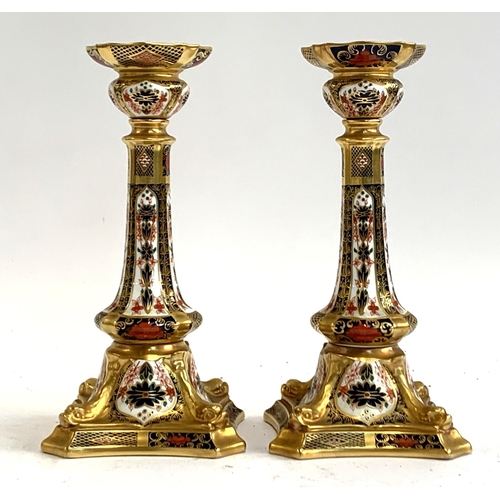 139 - A pair of Royal Crown Derby candlesticks, pattern number 1128, 26.5cm high