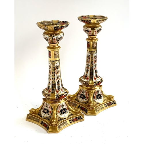 139 - A pair of Royal Crown Derby candlesticks, pattern number 1128, 26.5cm high