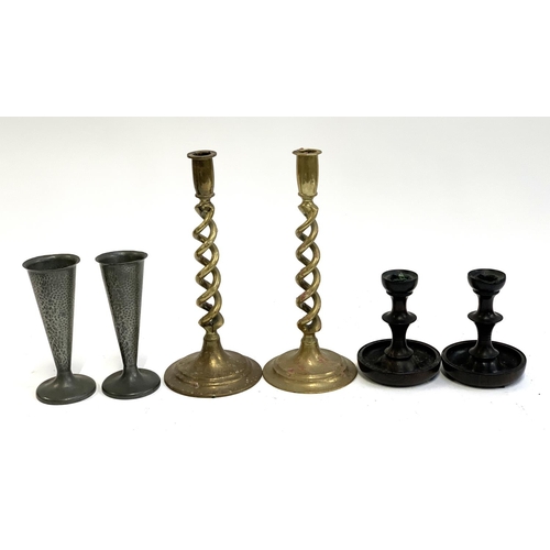 245 - A pair of turned ebony candlestick holders, 13.5cm; brass barleytwist candlestick holders 30cmH; and... 