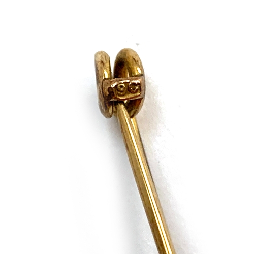 36 - A 9ct gold stock pin, 1.4g