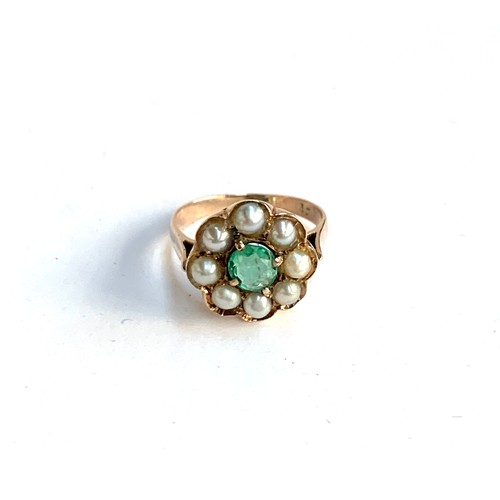 15 - A 14ct gold cluster ring set with a central emerald surrounded by a halo of pearls, size N, approx. ... 