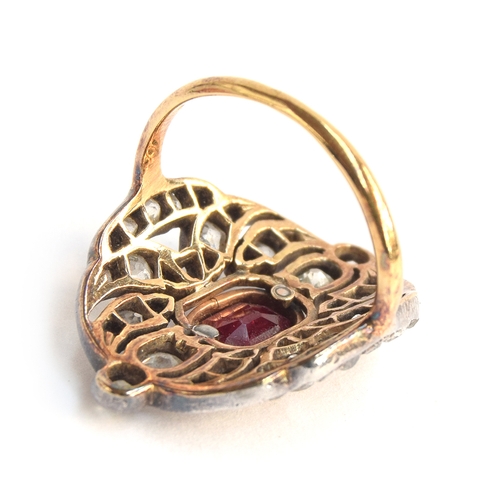 14 - A Victorian 18ct gold and silver openwork ring, 38 old cut diamonds surrounding a central ruby, appr... 