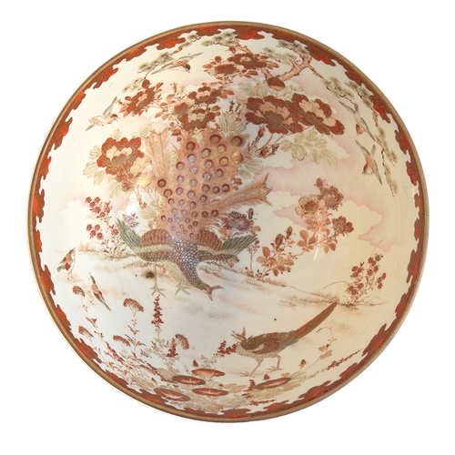 119 - A large Japanese Meiji era Satsuma bowl, decorated with peacocks and flying sparrows amongst foliage... 