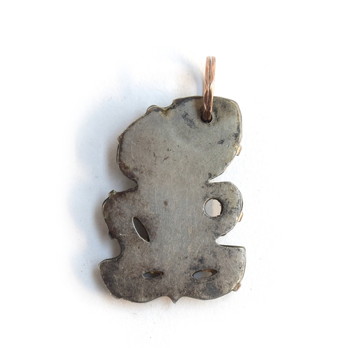 39 - A 19th century Maori Hei Tiki pounamu nephrite pendant, four overall perforations, well carved with ... 