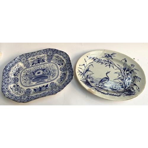 67 - A semi nankeen china blue and white meat plate together with one by Wedgwood depicting heron with ee... 