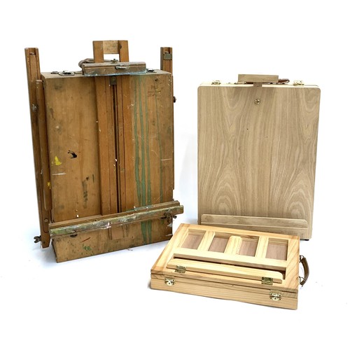 153 - A beechwood folding artists' easel, together with one other tabletop easel in as new condition and o... 