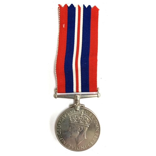 165 - A World War II service medal, possibly issued to D Beresford