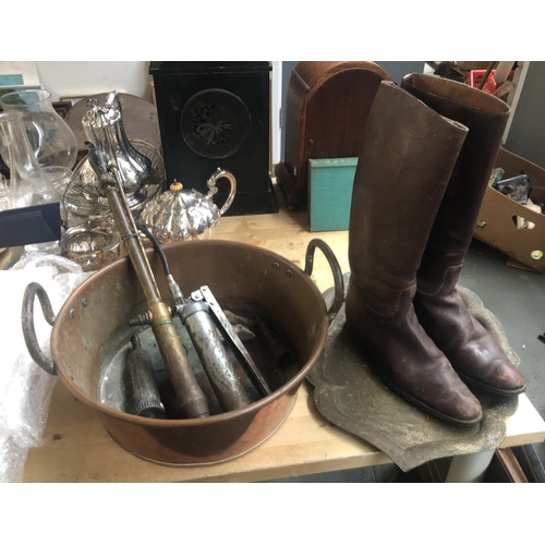 150 - A mixed lot to include a copper pan, brass tray, vintage grease gun and a pair of brown leather boot... 