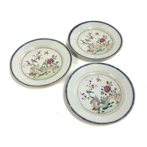 72 - Three Chinese porcelain plates with polychrome decoration depicting birds in a garden, 23cmD