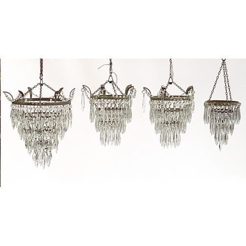 155 - A pair of three tier glass drop chandeliers, approx. 28cm long, together with a four tier chandelier... 