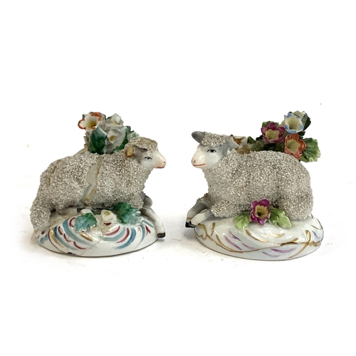 77 - A pair of Staffordshire sheep figurines, both af, approx. 6cmH