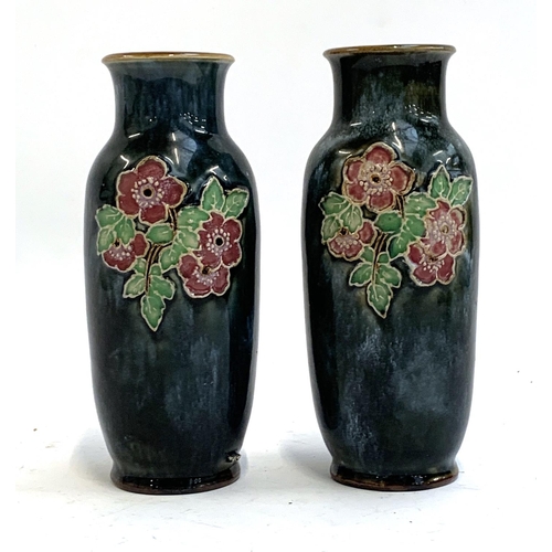 82 - A pair of Royal Doulton stoneware vases with tube lined prunus design, stamped to base 9484, 20.5cmH