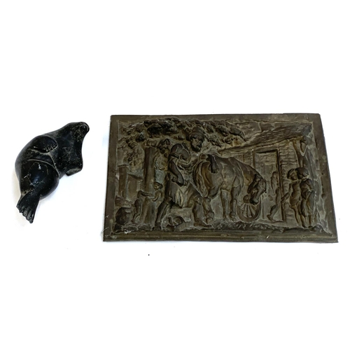 199 - A heavy cast metal plaque depicting a pastoral scene, 24x38cm, together with a carved soapstone seal