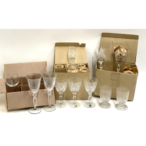 91 - A quantity of cut and etched glass to include a pair of Waterford crystal goblets with engraved swag... 