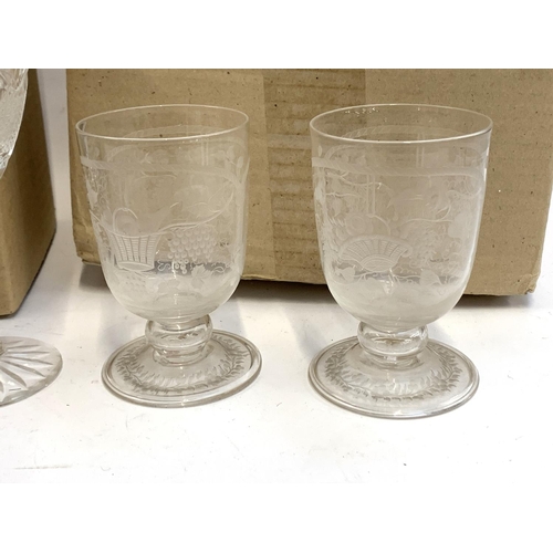 91 - A quantity of cut and etched glass to include a pair of Waterford crystal goblets with engraved swag... 