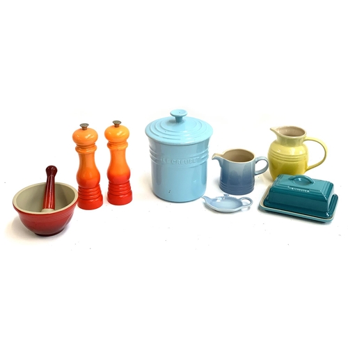 124 - A quantity of Le Creuset comprising butter dish, pestle and mortar, biscuit barrel, tea strainer, mi... 