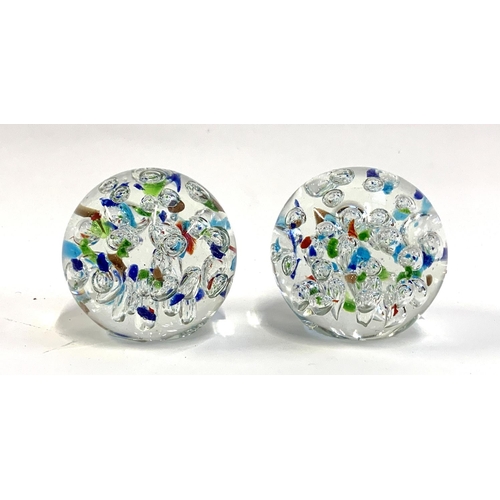 131 - A pair of glass bubble paperweights, boxed, each approx. 11cmH