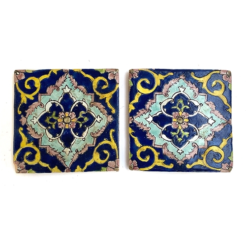 92 - Two Arabesque glazed ceramic tiles, 14.5cm square