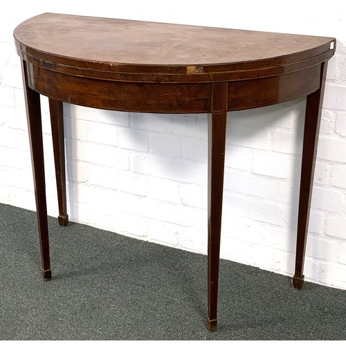 858 - A Regency mahogany demilune table, foldover top with boxwood stringing, on square tapered legs and s... 