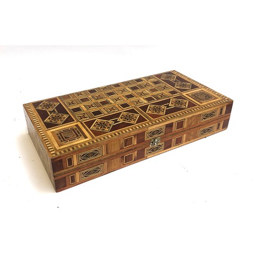 131B - A parquetry and marquetry chess and backgammon board, with pieces, 50cmW