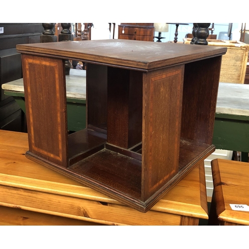 863 - An Edwardian mahogany and satinwood crossbanded table top rotating bookshelf, 35x35x31.5cmH