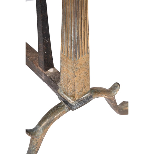 428 - A pair of pressed andirons in George III style, with urn finials above the tapering stems and bipeda... 